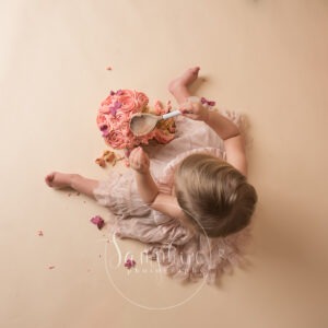 cake smash session images above spoon pink sussex photo