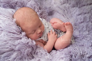 baby girl lilac sleepy choosing newborn photographer Horsham