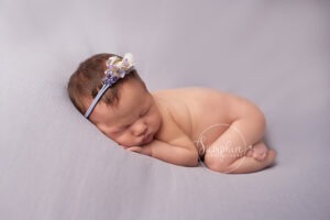 newborn portait baby safety sleeping girl headband lilac