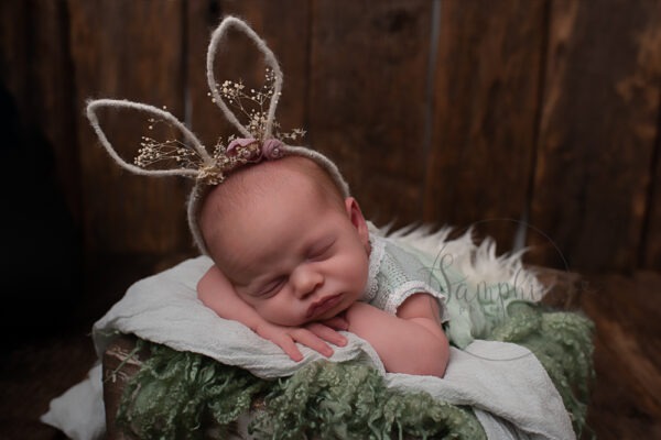 sleeping baby girl bunny ears green studio portrait newborn photographer Billingshurst Samphire Photography West Sussex