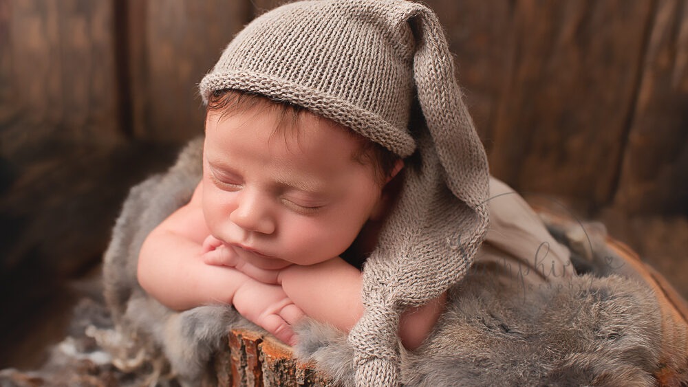newborn photographer sussex baby boy neutral natural browns knits fur wood by Samphire Photography
