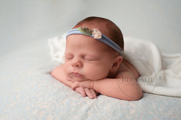 experienced newborn photographer sussex sleeping girl blue headband Samphire Photography