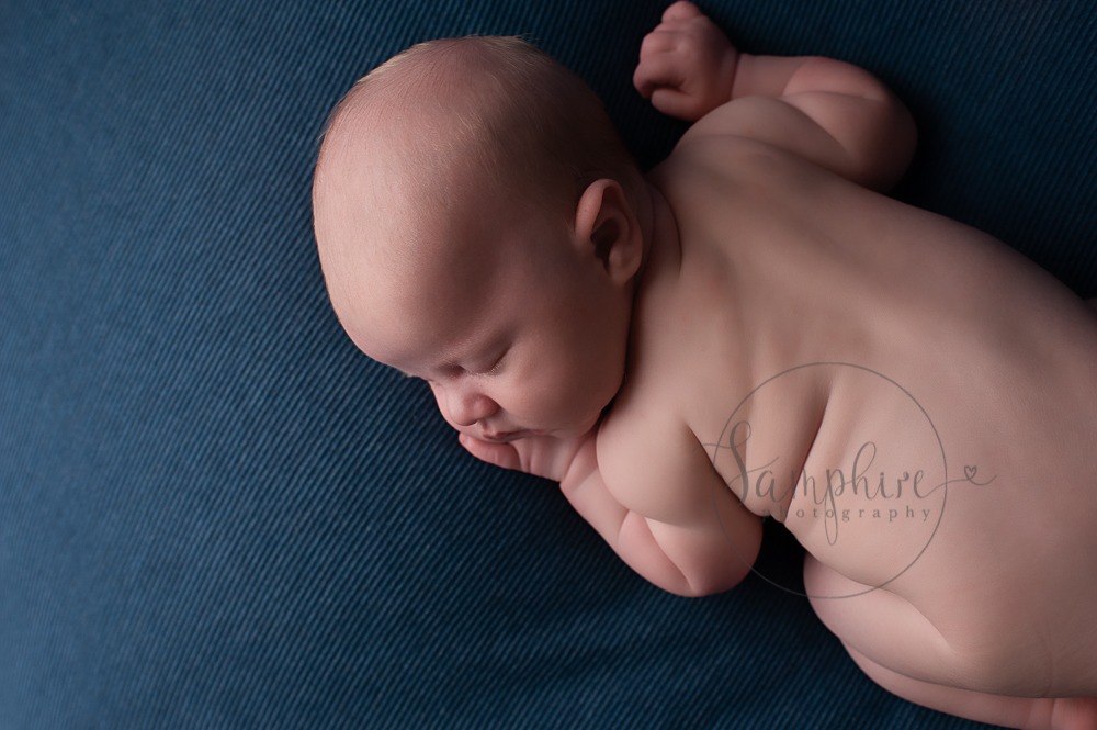 West Sussex Newborn Photographer sleeping baby boy on blue by Samphire Photography Horsham