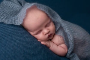 West Sussex Newborn Photographer baby boy in blue layers by Samphire Photography Horsham