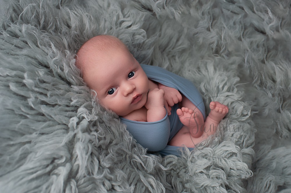 West Sussex Newborn Photographer baby boy awake in blue by Samphire Photography Horsham