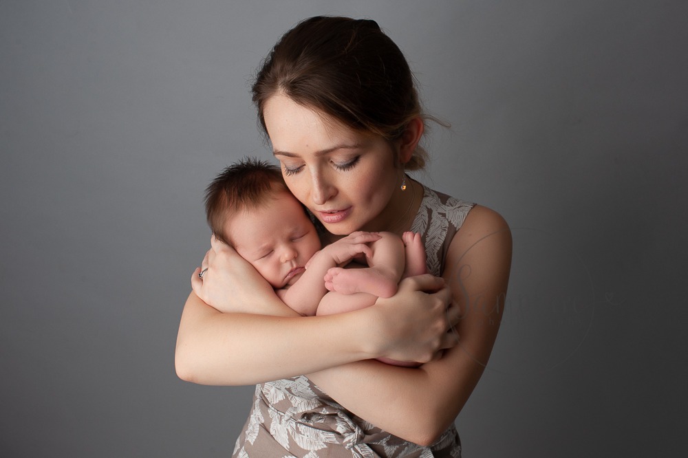 Experienced newborn photographer West Sussex mother baby boy studio portrait Samphire Photography