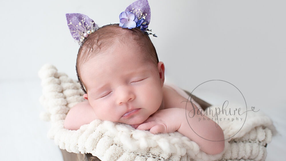 Sussex newborn baby pictures sleeping girl purple kitten ears headband Samphire Photography