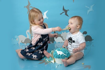 dino cake smash and splash birthday boy blue white siblings Samphire Photography