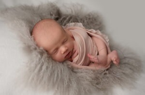 wrapped baby girl in pink by Samphire Photography