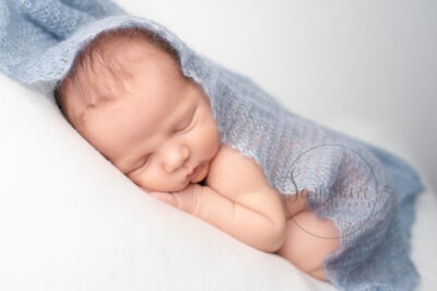 baby boy asleep white blue knit Newborn Photography West Sussex Samphire Photography