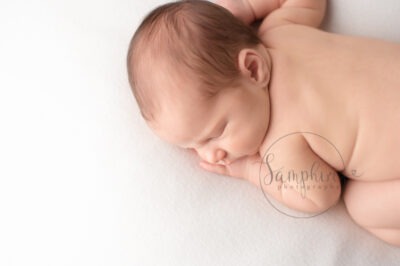 baby boy asleep cosy white Newborn Photography West Sussex Samphire Photography