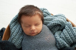 New baby portraits West Sussex blue knits layers Samphire Photography