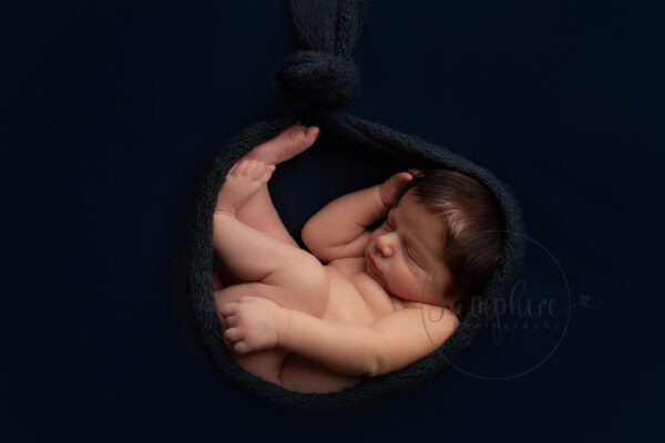 New baby portraits West Sussex blue background Samphire Photography