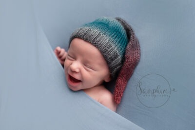 Smiling baby taken during by newborn photograph Horsham Samphire Photography