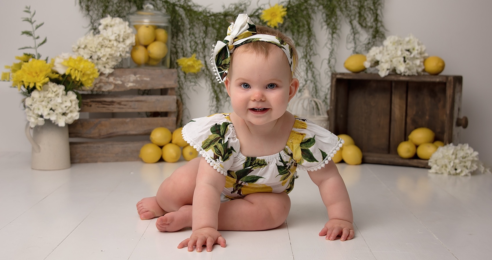 Cake Smash Photographer and baby photo shoots little girls with lemon props Samphire Photography Sussex