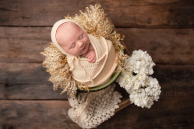 sleeping Newborn wrapped in yellow by Samphire Photography Sussex newborn mini session