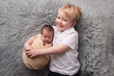 newborn baby shoot studio portrait with brother