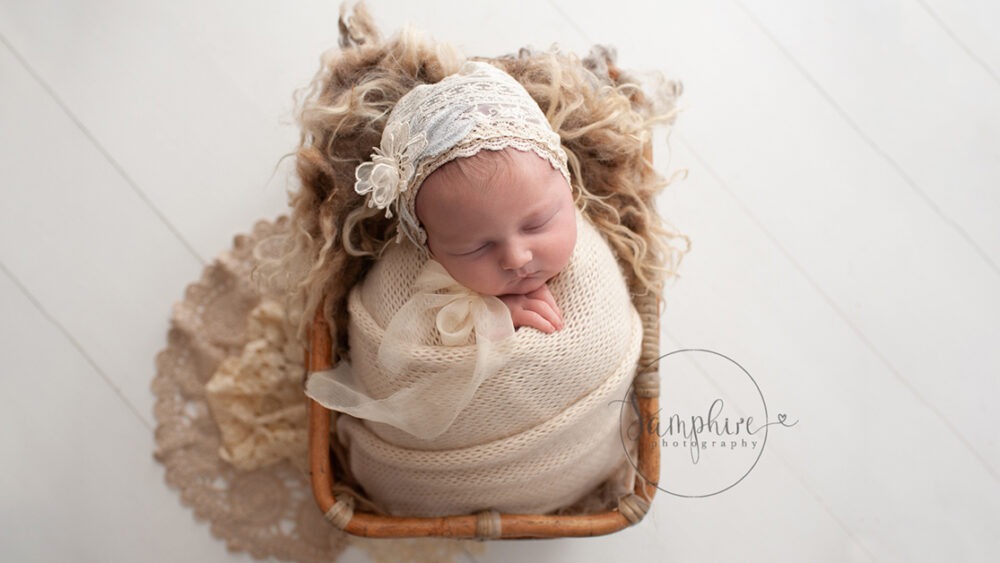 newborn photoshoot sussex cream bonnet