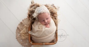 newborn photoshoot sussex cream bonnet