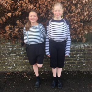 Girls dressed as tweedle-dum and tweedle-dee