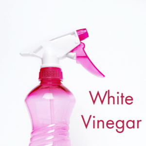 pink spray bottle of white vinegar