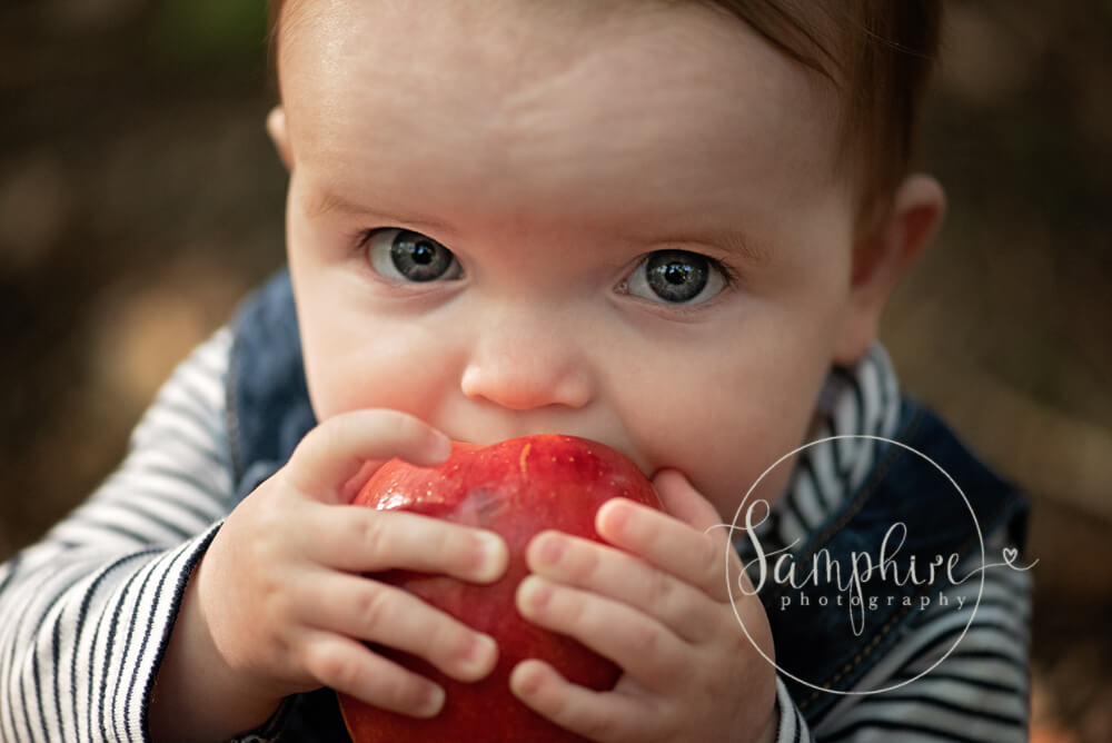 little girl with red apple