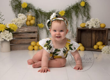 baby girl surrounded with lemons in billingshurst