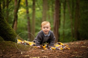cute girl in woodland autumn portraits with yellow blanket