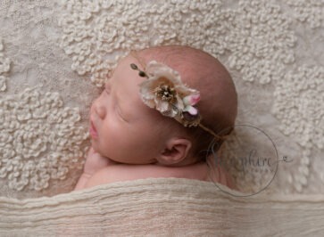 baby girl asleep wearing floral headband