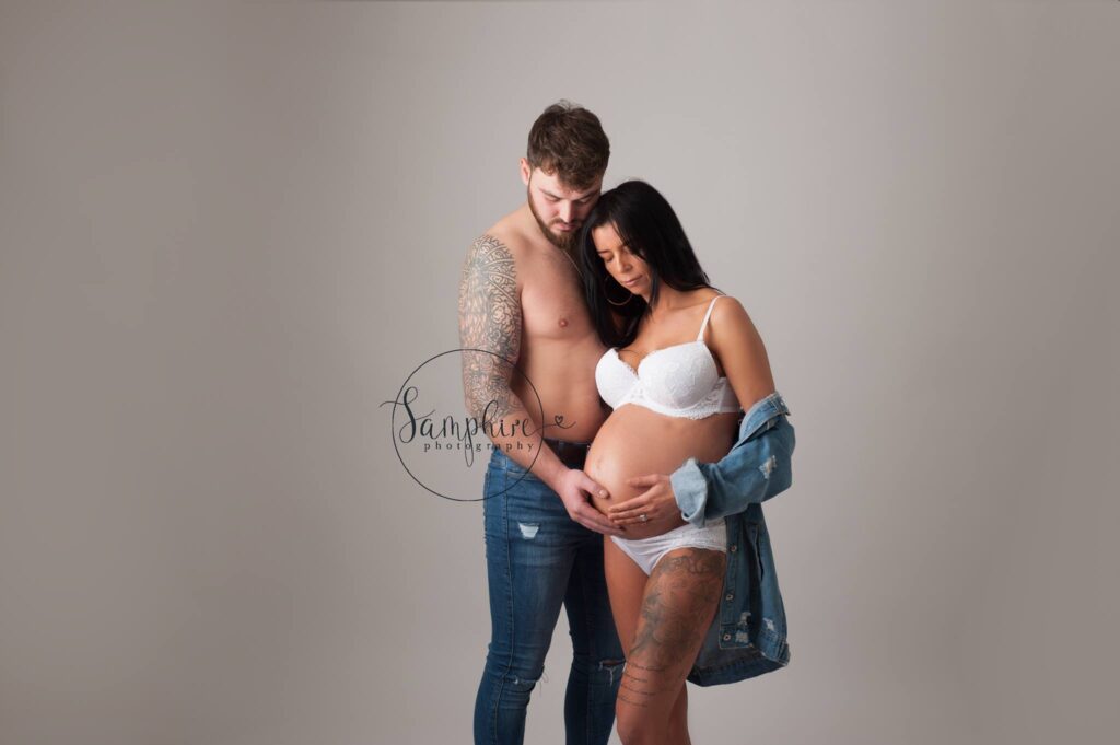 couples maternity session in the studio