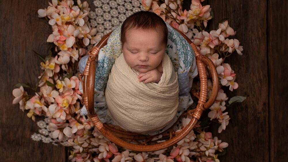 Behind the Scenes of a Newborn photoshoot Horsham at Samphire Photography showing girl in basket