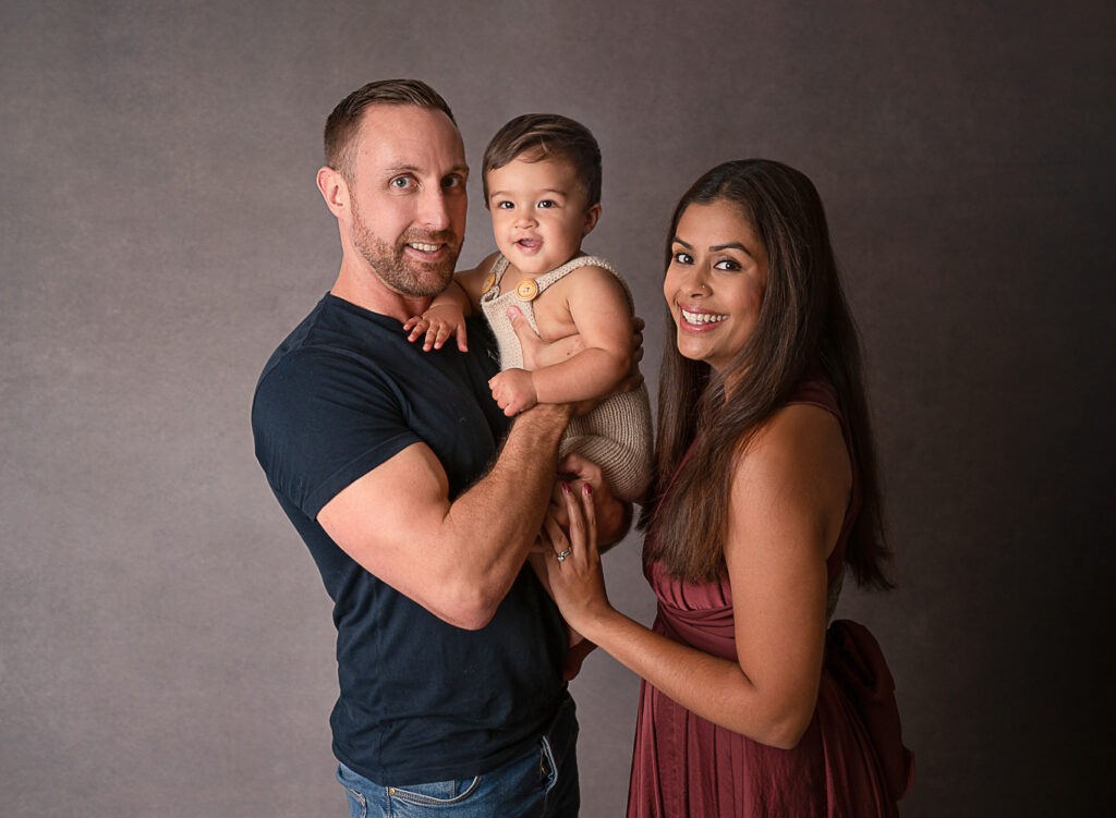 Smiling family with new baby family photoshoot horsham