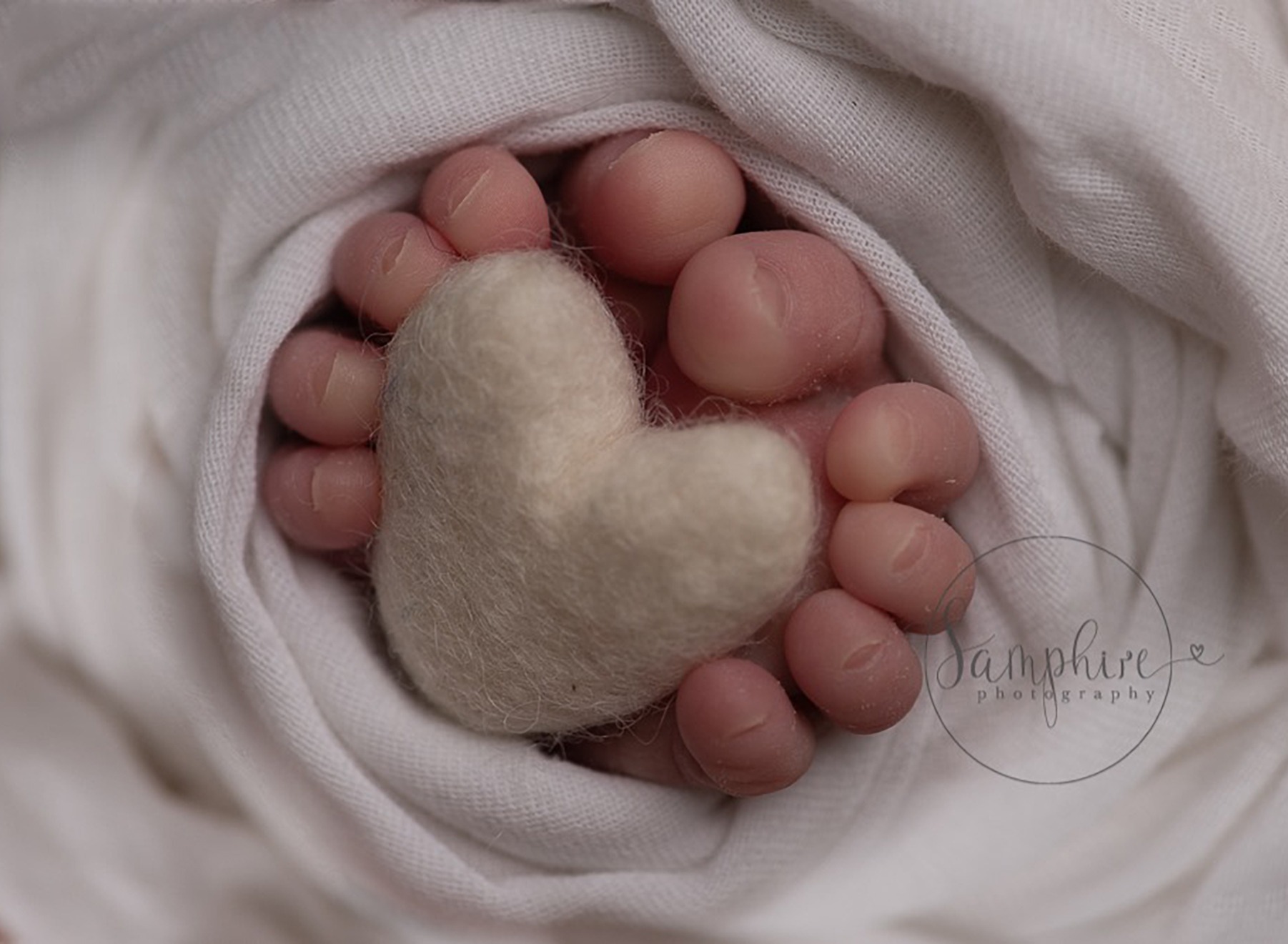 newborn baby feet and heart