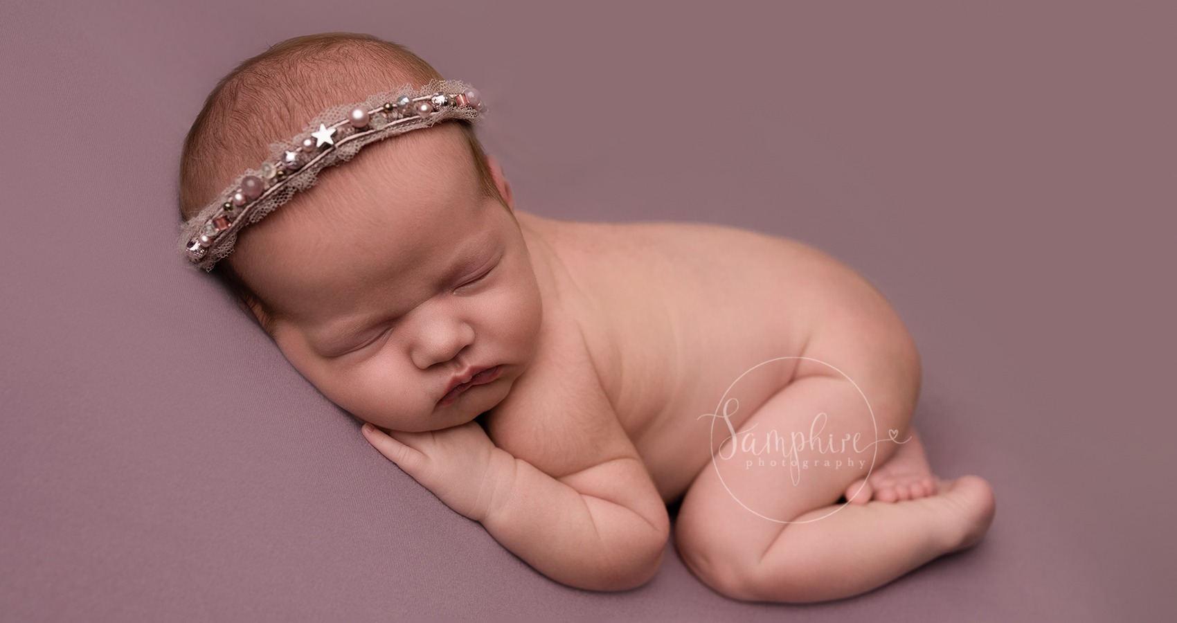 sleepy baby girl on lilac with samphire photography based near haywards heath