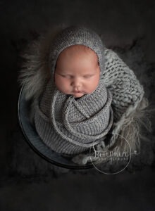 gorgeous baby boy in greys at his newborn mini session in west sussex