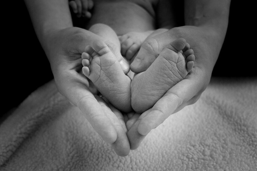 hands holding baby's feet