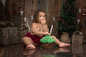 Little girl eating Christmas cupcake