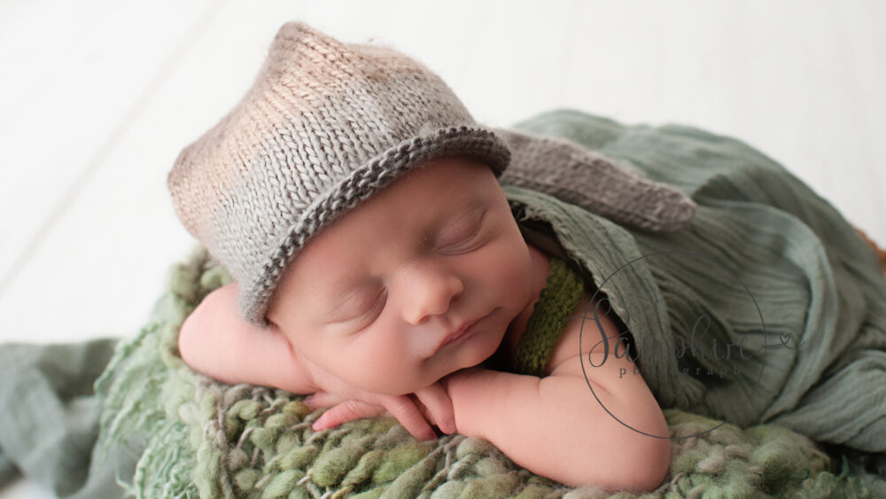 newborn photographer Shoreham studio portrait sleeping boy wearing knitted hat