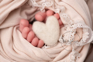 newborn toes with felted heart